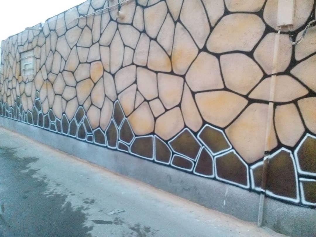 نقاشی طرح سنگ روی دیوار سیمانی - 5